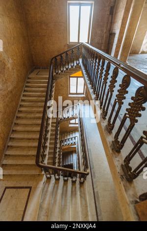 Top view of old vintage decorated staircase in abandoned mansion. Stock Photo