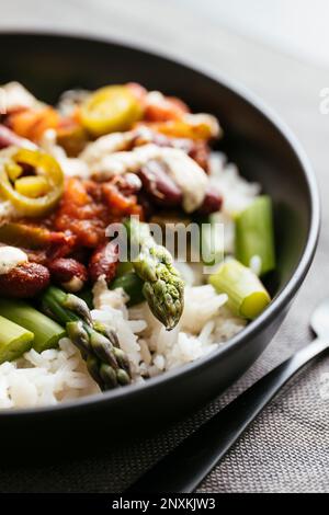 Fresh Asparagus with Mexican Sauce on Rice Stock Photo