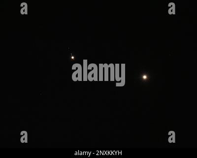 Sheerness, Kent, UK. 1st Mar, 2023. UK Weather: planets Jupiter (left) and Venus (right) seen next to each other in a conjunction in the night sky above Sheerness, Kent this evening. Credit: James Bell/Alamy Live News Stock Photo