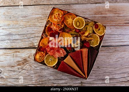 homemade fruit chips. texture. wooden background Stock Photo