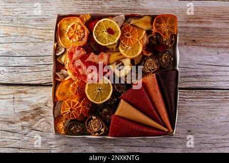 homemade fruit chips. texture. wooden background Stock Photo