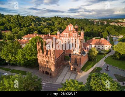 Vilnius Old Town and St. Anne Church with Hill of Three Crosses in Background. Lithuania. Sunset Light Stock Photo