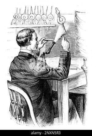 An illustration of a man making a glass bulb for Thomas Edison's new electric light. Frank Leslie's Illustrated Newspaper, 1880. Stock Photo