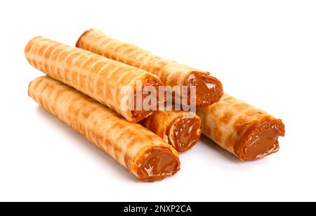 Delicious wafer rolls with boiled condensed milk isolated on white background Stock Photo