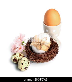 Easter eggs and sakura flowers isolated on white background Stock Photo