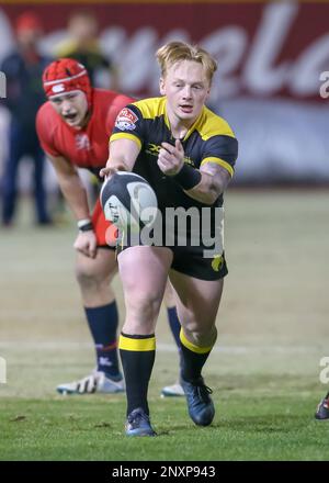 SUGAR LAND, TX - JANUARY 13: Houston SaberCats scrumhalf Conor Murphy (9)  reaches out to tackle Vancouver Ravens center James Thompson (23) during  the rugby match between the Vancouver Ravens and Houston