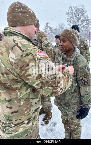 Lt. Col. Russell Lemler, battalion commander, and Command Sgt. Maj. John Folger, senior enlisted advisor, both assigned to 2nd Battalion, 15th Field Artillery Regiment, 2nd Brigade Combat Team, 10th Mountain Division, took the opportunity to recognize and reward a few outstanding Soldiers during a mass award presentation at the battalion compound on Jan. 27, 2023. The brigade command team, Col. Scott D. Wence, brigade commander, and Command Sgt. Maj. Christopher Donaldson, assisted in the award presentation. Stock Photo