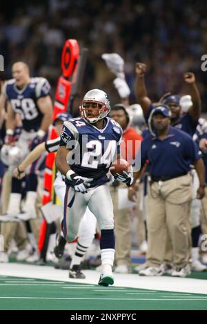 3 Feb 2002: Ty Law of the New England Patriots returns an interception for  a TD during the Patriots 20-17 victory over the St. Louis Rams in Super Bowl  XXXVI at the