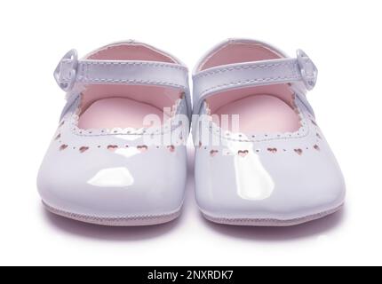 Pair of Girl's Baby Shoes Cut Out on White Front View. Stock Photo