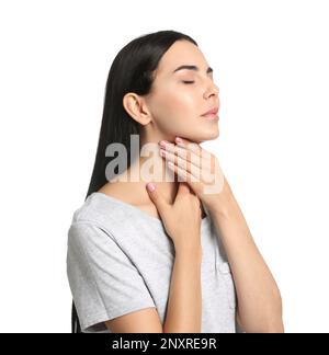 Young woman doing thyroid self examination on white background Stock Photo