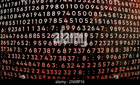 Programming on a black background with red illumination. Motion. Dark background in animation with appearing lines with numbers. High quality 4k foota Stock Photo
