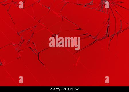 broken red smart phone screen with cracked glass Stock Photo