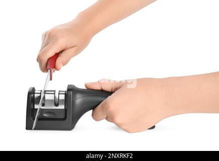 Woman sharpening knife on white background, closeup Stock Photo