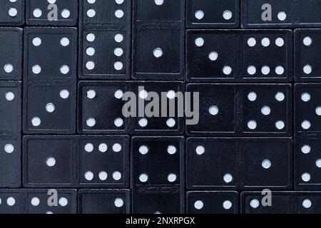 Black Wood Dominos Background Close Up Top View. Stock Photo