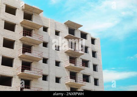 Beautiful unfinished white brick multistory building outdoors Stock Photo