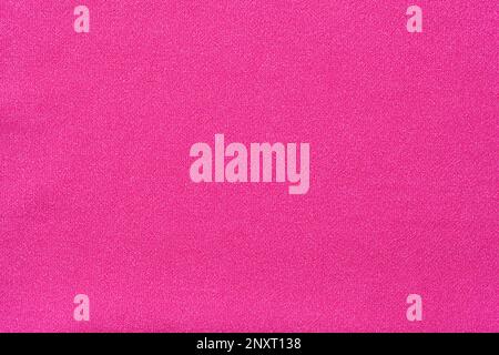 Flat Pink Polyester Fabric Background Close Up. Stock Photo
