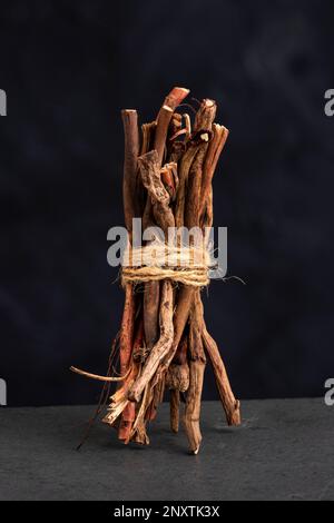 Dried organic sarsaparilla sticks - Smilax aspera Stock Photo