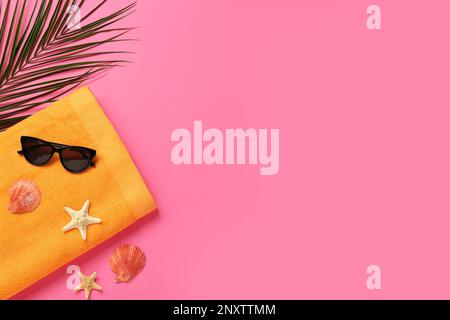 Flat lay composition with different beach objects on pink background, space for text Stock Photo