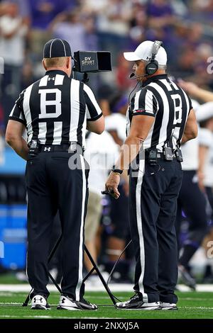 Referee Bill Vinovich (52) watches a replay in the second half of