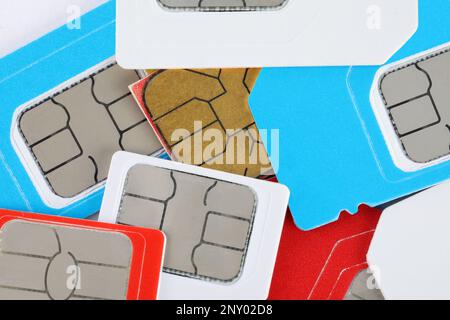 Different SIM cards as background, top view Stock Photo