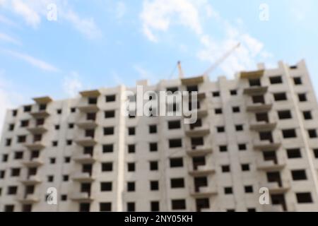 Blurred view of unfinished white building outdoors Stock Photo