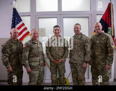 (from left to right) 4th Infantry Division G-3 operations Sergeant Major Stephen Bouleris, Command Sgt. Maj. Cliff Burgoyne, III Armored Corps command sergeant major, Command Sgt. Maj. Alex Kupratty, command sergeant major of the 4th Infantry Division and Fort Carson, Command Sgt. Maj. Raymond S. Harris, V Corps command sergeant major, and Command Sgt. Maj. Christopher A. Prosser, V Corps command sergeant major, poses for a group photo during a visit at Boleslawiec, Poland, Feb 21, 2023. Throughout the day, the sergeant's major discussed the Soldier's living conditions and morale. Stock Photo