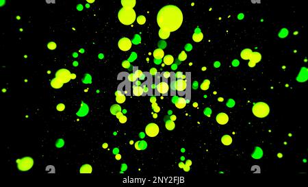 Abstract flying green spheres over the black background. Motion. Spreading 3D round shapes Stock Photo