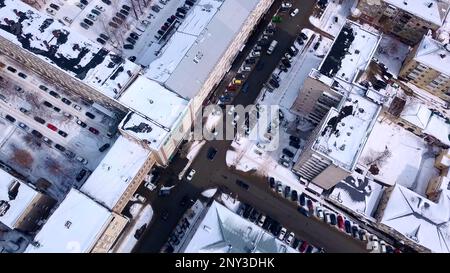 View of the winter city. Clip.Landscape with narrow roads for the movement of cars around high-rise residential buildings. High quality 4k footage Stock Photo