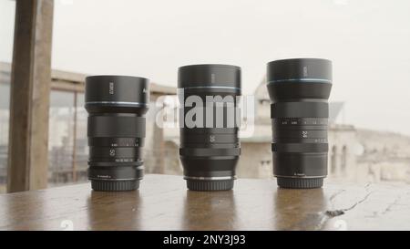 Professional equipment for shooting. Action. Camera lenses taken in nature, and the camera itself for shooting landscapes and portraits. High quality Stock Photo