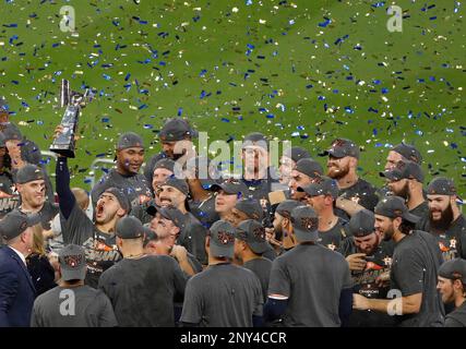 Houston Astros shortstop Carlos Correa hoists the World Series championship  trophy as he walks on the st…