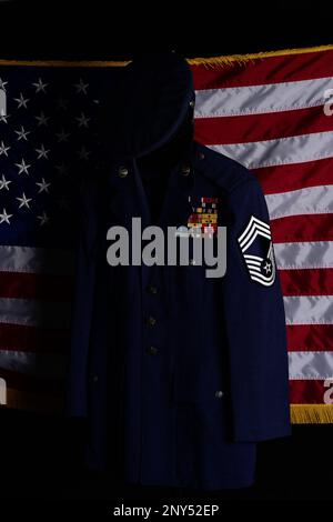 Service uniform items belonging to the late Chief Master Sgt. (Ret) Paul Kerchum are displayed at Davis-Monthan Air Force Base, Arizona, Jan. 26, 2023. Kerchum was one of the few remaining prisoners of war from the Bataan Death March during World War II, and his uniform items were donated by his family after his death. Stock Photo