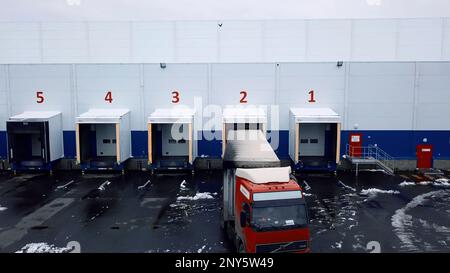 Large garages. Creative. Helicopter view of parking spaces for large trucks with bodies. High quality 4k footage Stock Photo