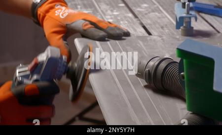 Men's work. Creative. Application of equipment for cross-cutting of rolled metal blanks and products made of various alloys. High quality 4k footage Stock Photo