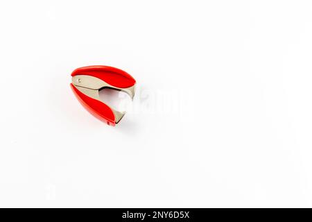 Staple remover on white background high angle view Stock Photo