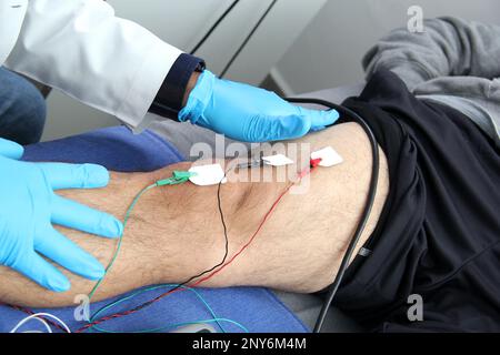 Electromyography EMG and Somatosensory Evoked Potential PEV of lower extremities, neurophysiological test applies electrical stimuli near the nerves Stock Photo