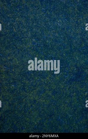 Dark blue-green handmade fiber paper. Stock Photo