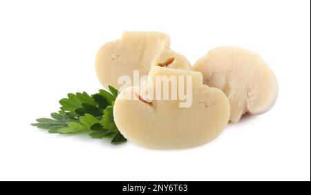 Cut marinated mushrooms and parsley isolated on white Stock Photo