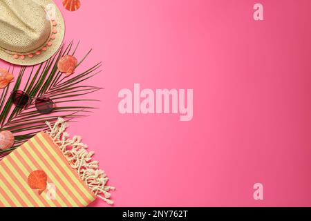 Flat lay composition with different beach objects on pink background, space for text Stock Photo