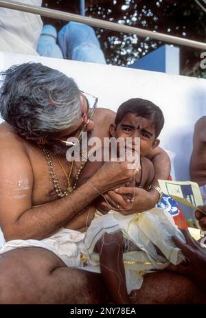 Ezhuthiniruthu ceremony on Vijayadasami day in Saraswathy temple at Panachikkadu near kottayam, Kerala, India Stock Photo