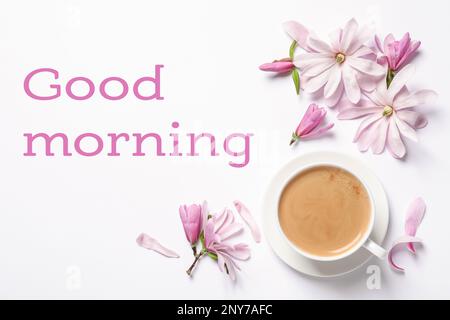 Good morning! Beautiful pink magnolia flowers and cup of aromatic