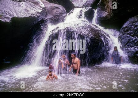 Tourists enjoying at Palaruvi waterfalls in Ariankavu, Kerala, South India, India, Asia Stock Photo
