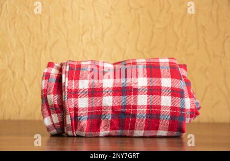 twisted home pants in a cage on the shelves Stock Photo