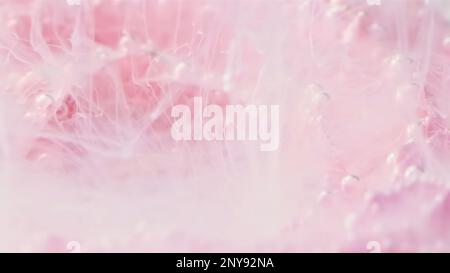 Flower smoke motion. Stock footage. Underwater illusion with paint spreading along the petals of a flower underwater Stock Photo