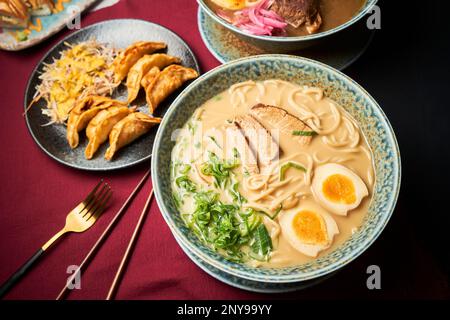 A top view of steaming hot Japanese dishes ready to serve Stock Photo