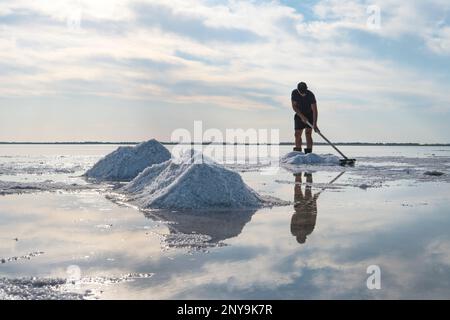 Salt mining on lake burlinskoye. Bursol'. Altai territory. Russia. Salt piles and water pool on Salinas Grandes salt flats Stock Photo