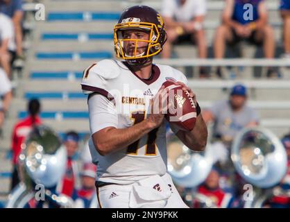 LAWRENCE, KS - SEPTEMBER 09: Central Michigan Running Back Kumehnnu Gwilly  (33) break through the tackle of Kansas Safety Bryce Torneden (1) during  the game between Central Michigan and Kansas on Saturday