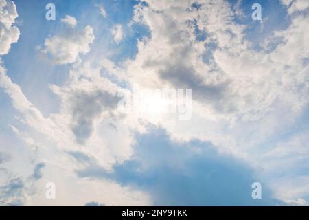 Blue sky with clouds and sun. Beautiful background. Stock Photo