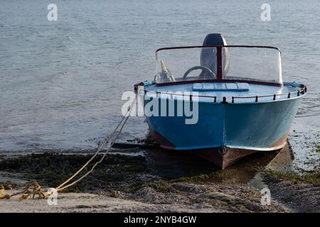 the boat stands on the bank of the river. Means of transportation on water. Stock Photo