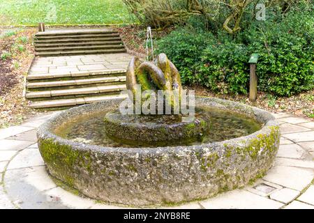 'Swan Fountain' sculpture by Willi Soukop 1950 in garden, Dartington Hall estate gardens, south Devon, England, UK Stock Photo