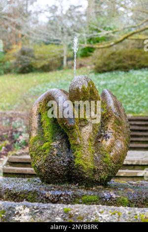 'Swan Fountain' sculpture by Willi Soukop 1950 in garden, Dartington Hall estate gardens, south Devon, England, UK Stock Photo